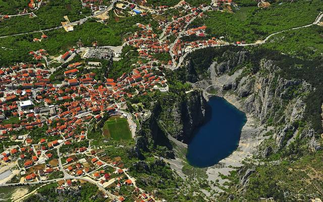 Aerial view of the Blue Lake sinkhole beside the town of Imotski