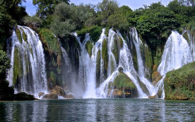 Kravice waterfalls spilling into a wide pool